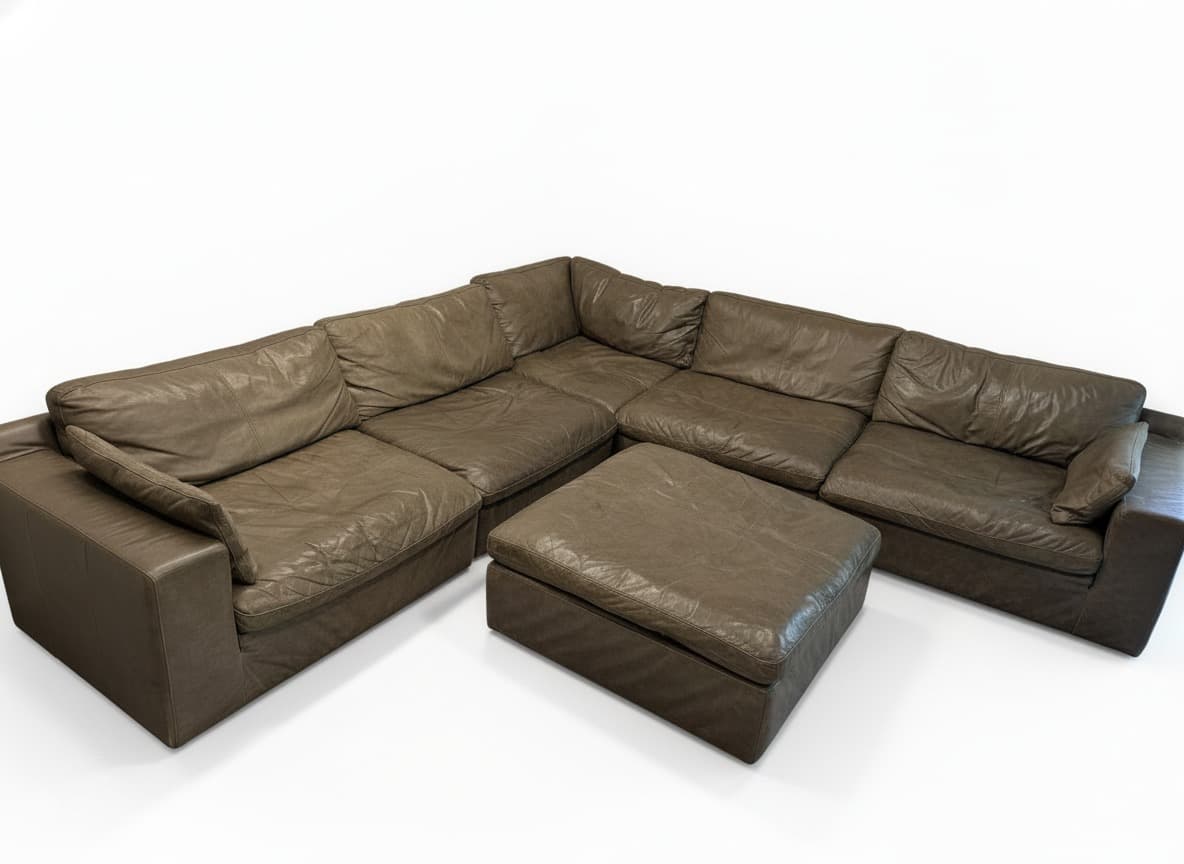 Ashley Alabonson concrete gray leather modular sectional on white background