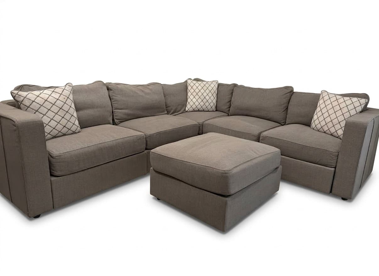 Lovesac Sactionals 6-seat modular sectional with storage ottoman in light gray on white background