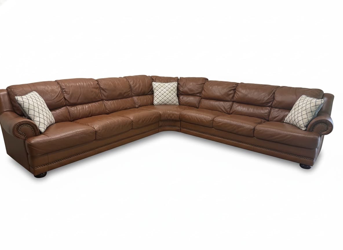 Natuzzi cognac brown leather sectional on white background