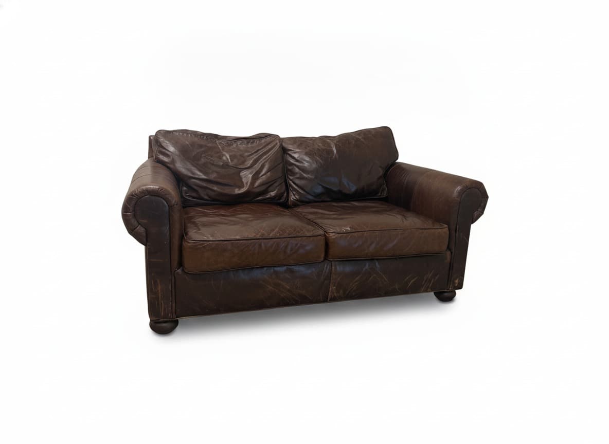 RH distressed brown leather loveseat on white background