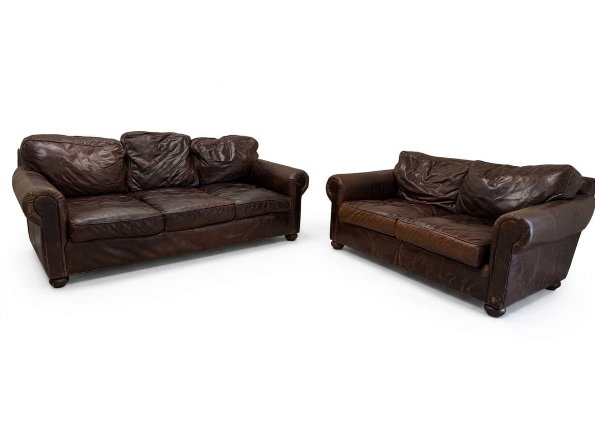 RH Lancaster leather sofa and loveseat set in distressed brown on white background
